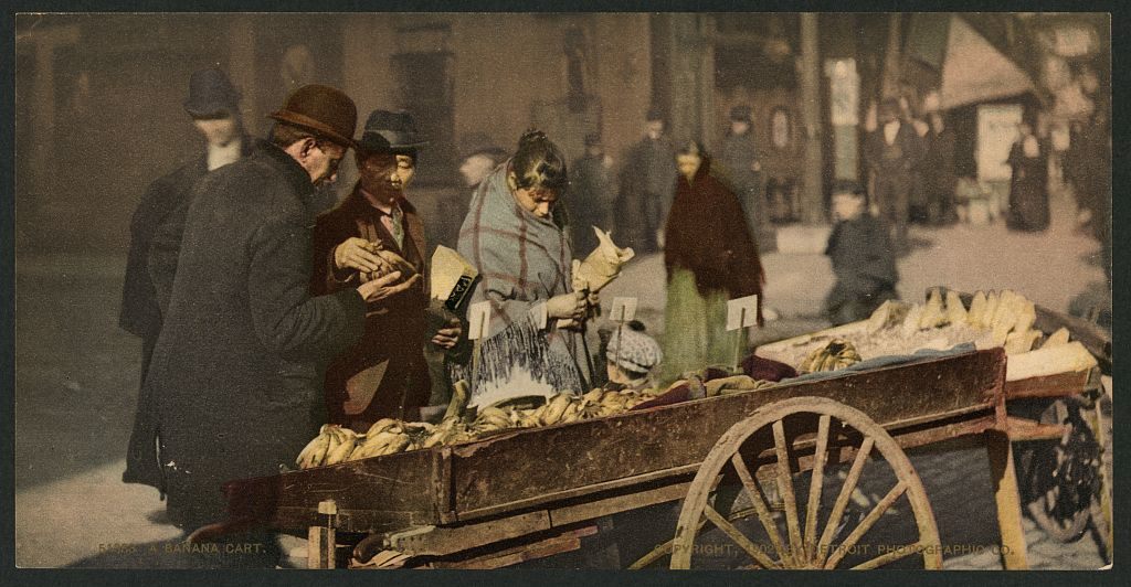 A colorized 1902 photograph shows a banana cart in Detroit